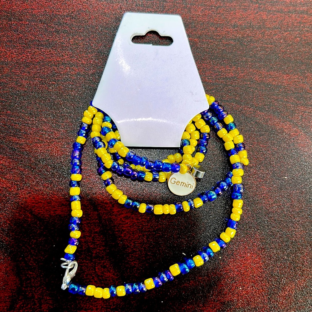 30 1/2in blue and gold belly chain with Gemini charm and birth stone